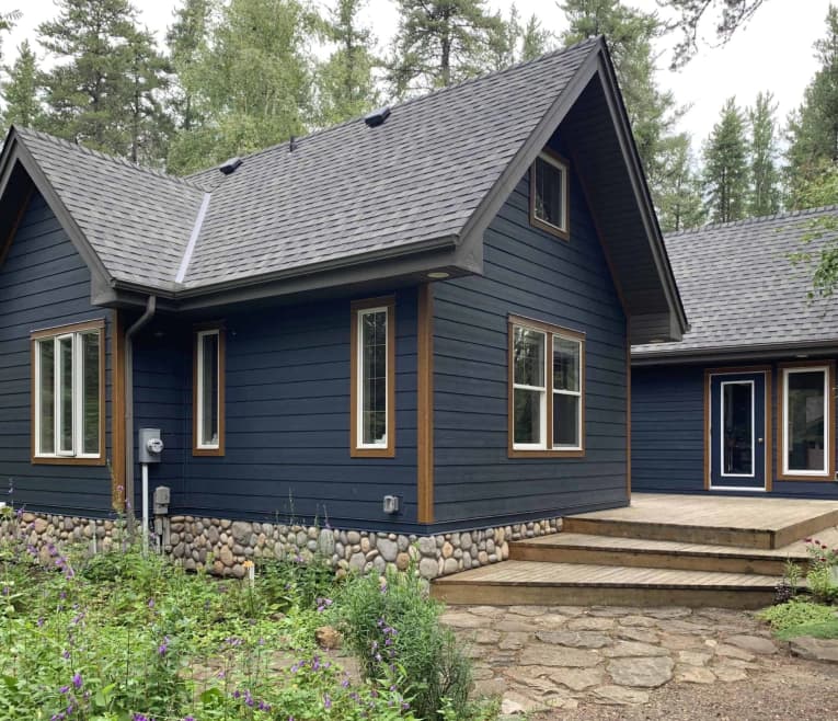 Navy-sided home with new windows and doors